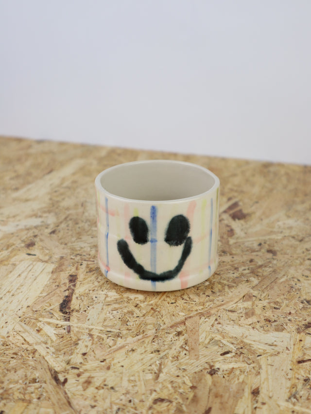 You are funny cup in pink & blue grid