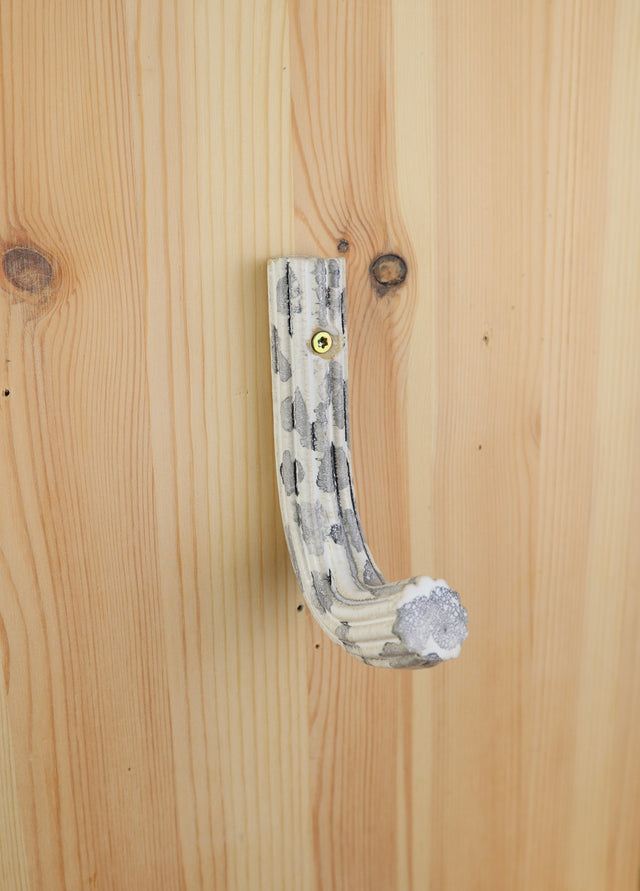 "White with a splash of black" Extruded hanger