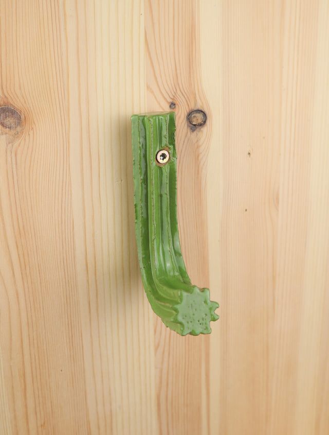 "The grass is green here" Extruded hanger