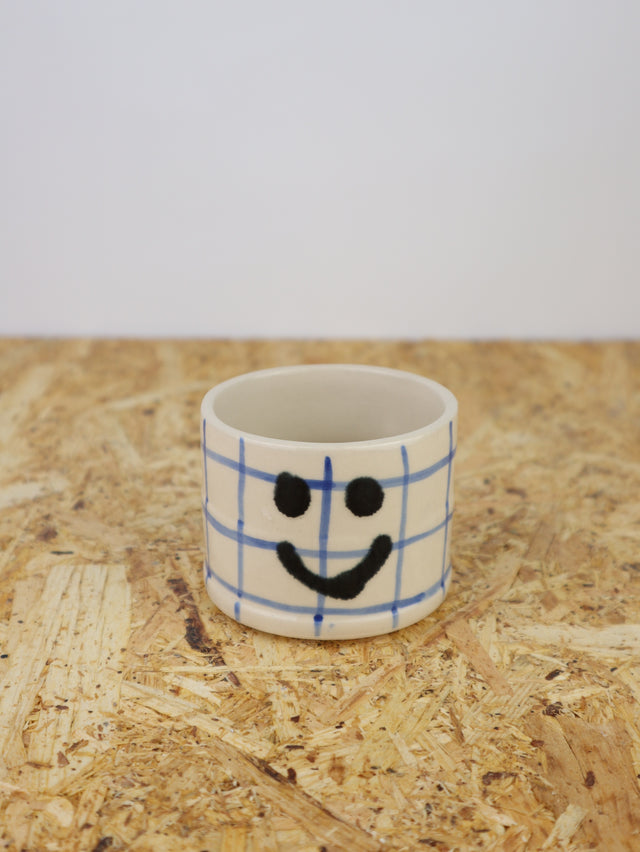 You are funny cup in blue grid