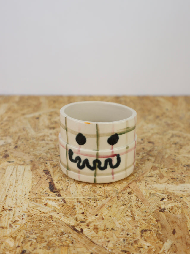 You are funny cup in green & maroon grid