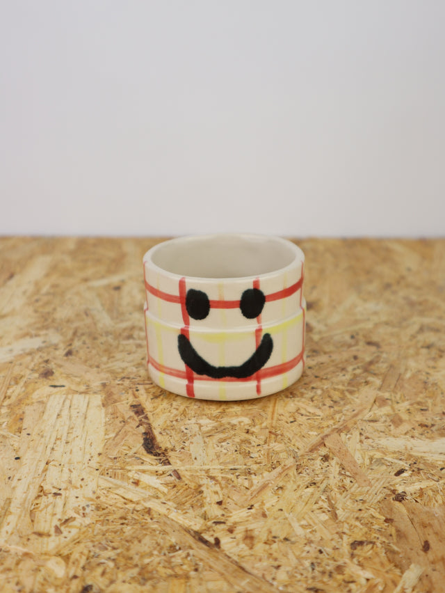 You are funny cup in red & yellow grid