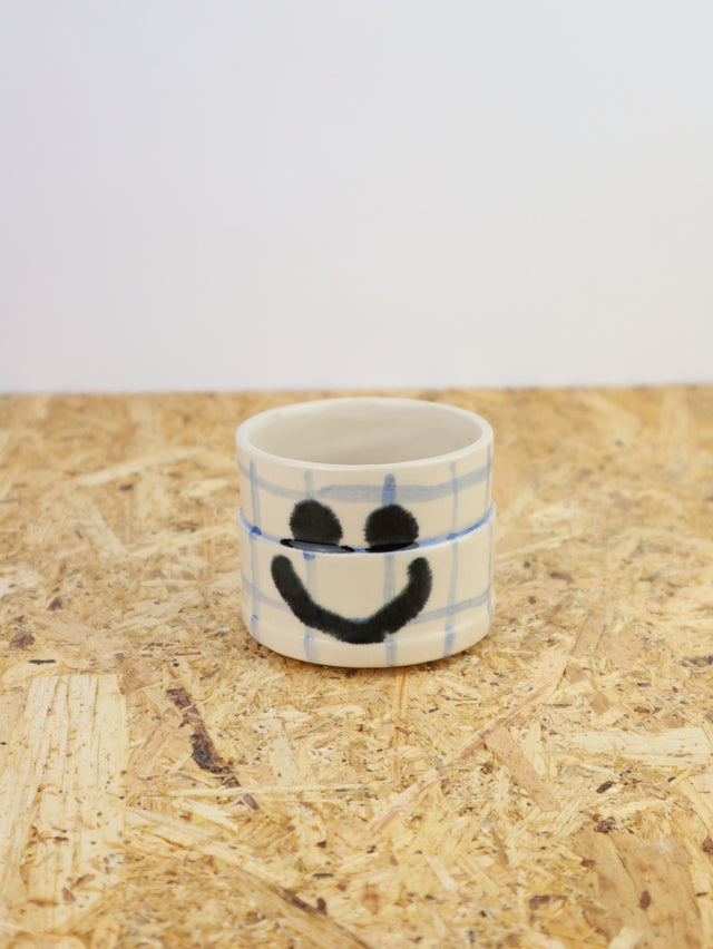 You are funny cup in blue grid