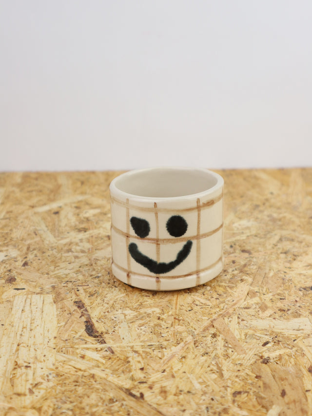 You are funny cup in brown grid