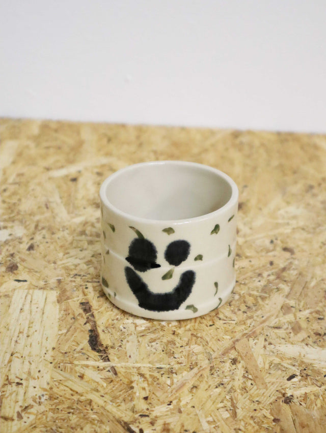 You are funny cup in dark green dots